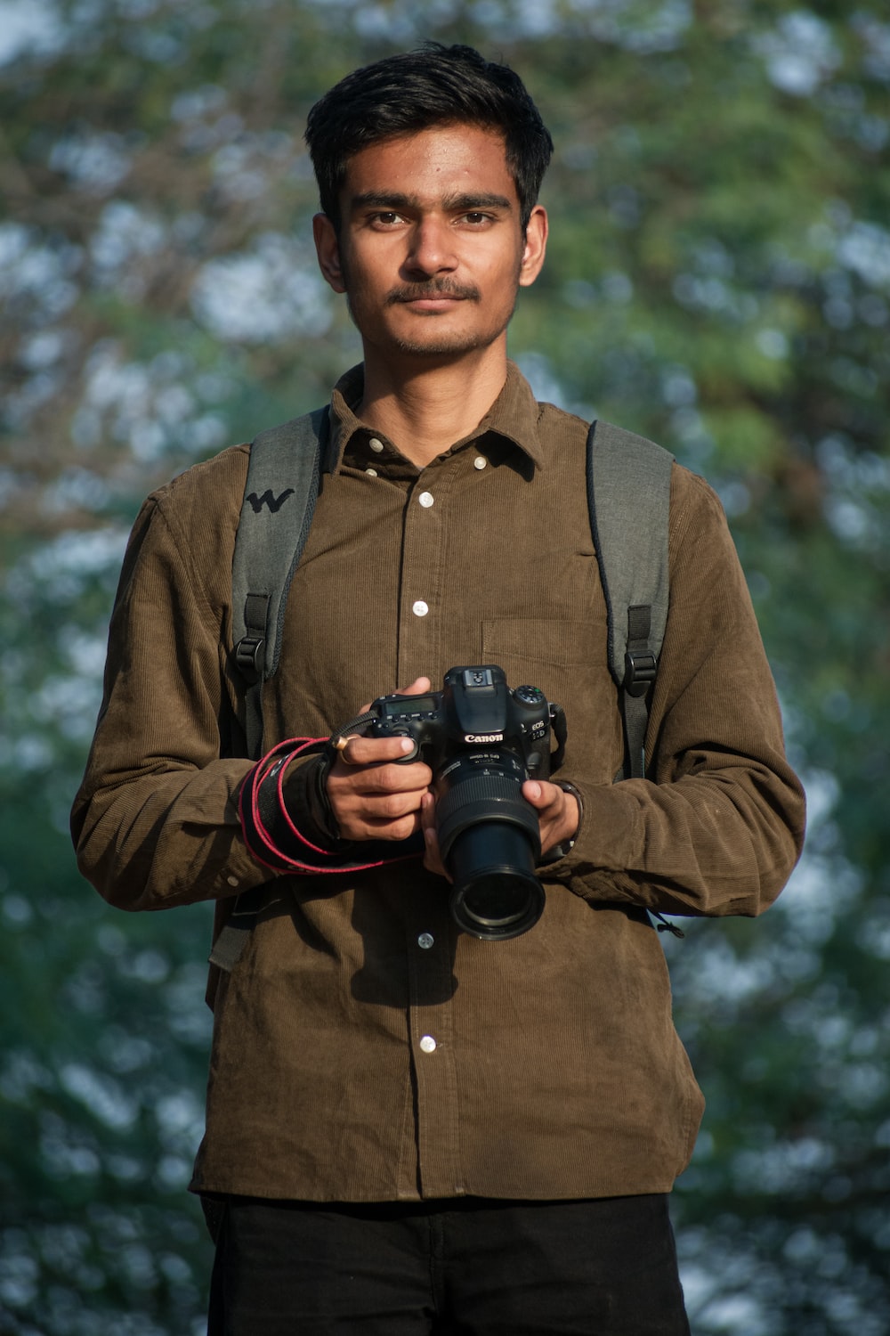 a man holding a camera in his hands