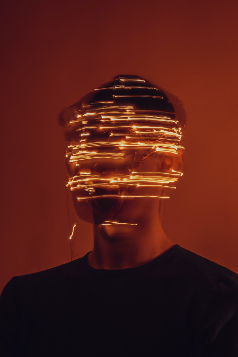 a man wearing a hat made of lights