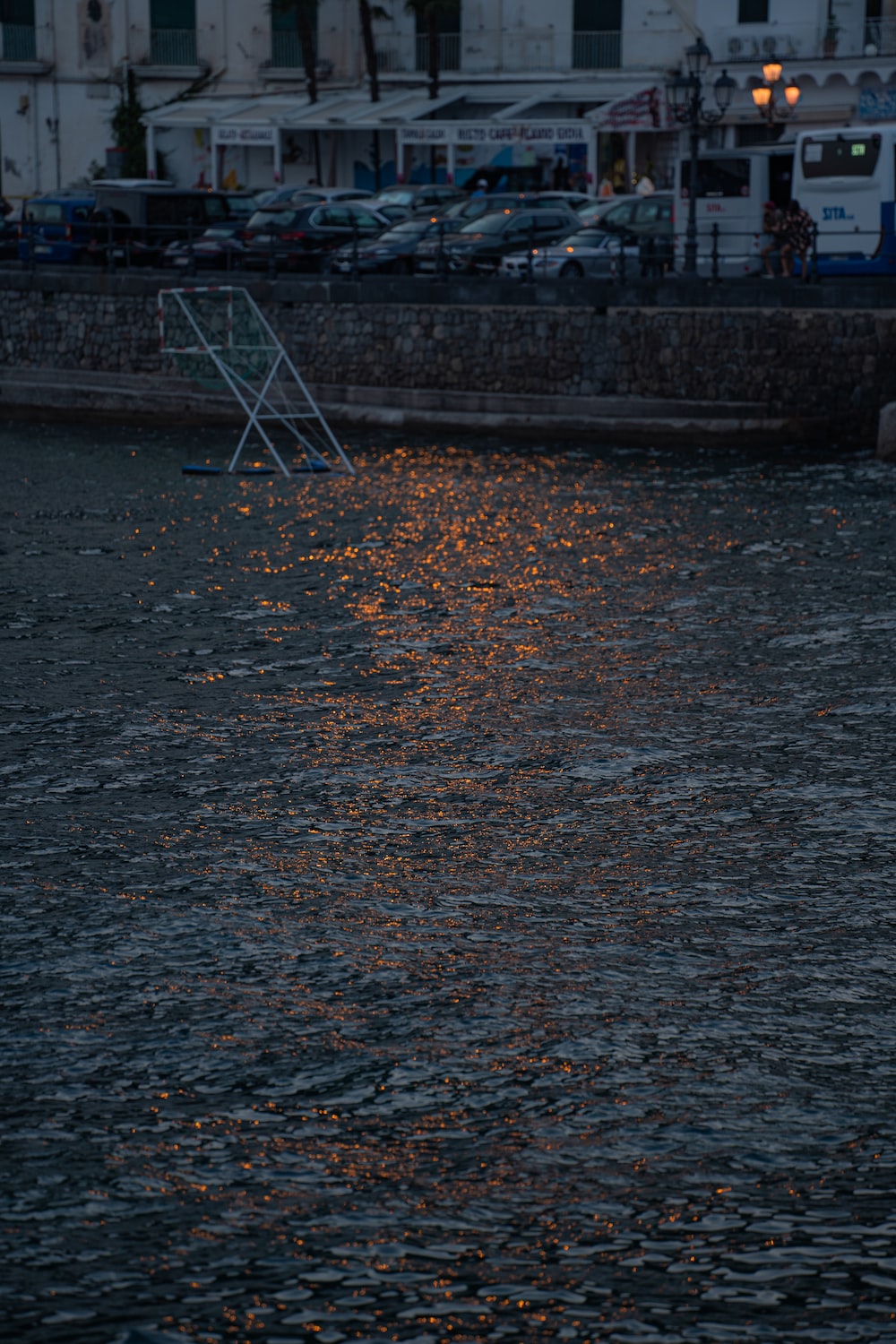 a body of water with a boat in the background